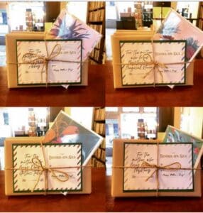 A picture of book bundles, individually wrapped and tied with string.