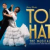 A promotional image for the musical Top Hat.